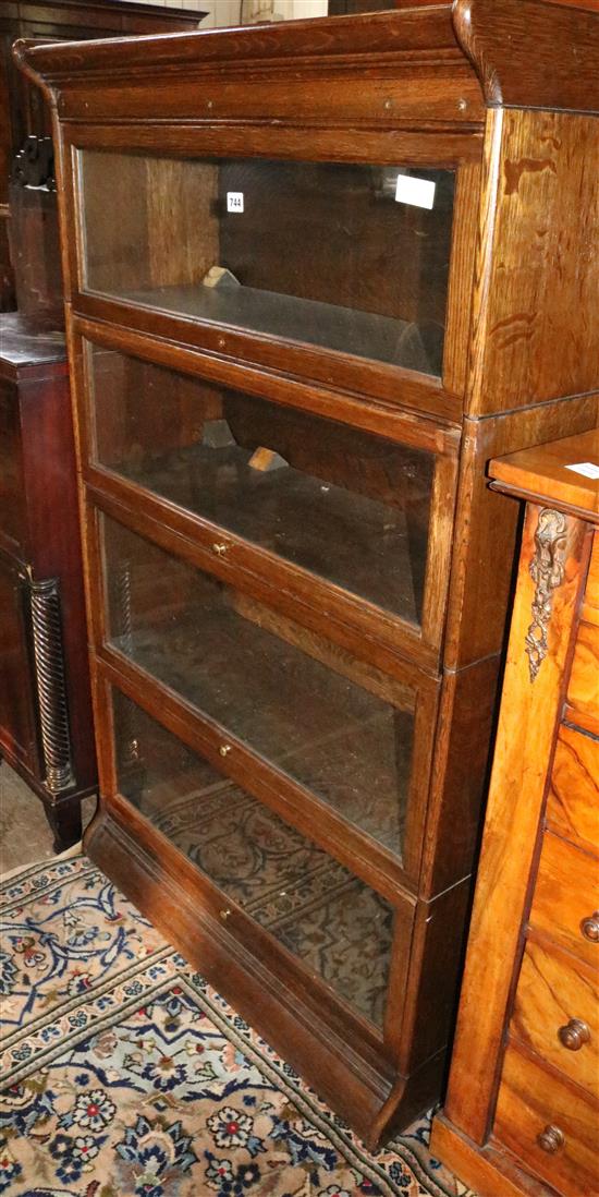 Oak sectional bookcase with 4 glazed sections(-)